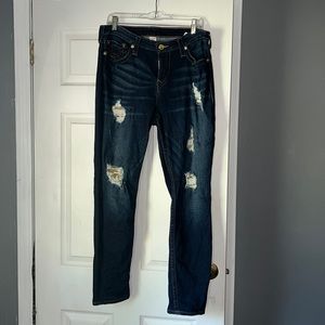 Dark denim with distressing. Gold sequins inside distressing.